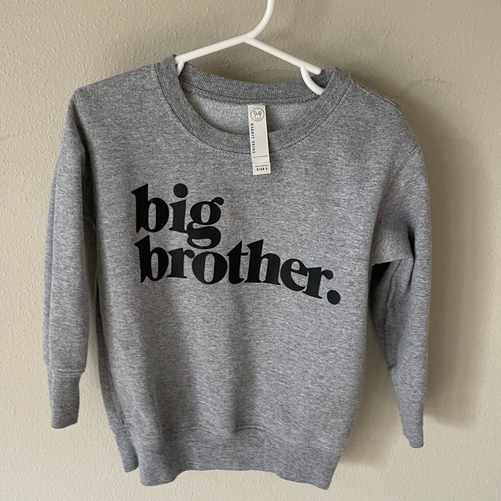 Big Brother grey sweatshirt.